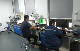 Quality engineer inspecting stamped parts